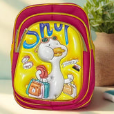 Colorful children's backpack with cartoon design on a light surface with a plant in the background