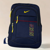 Blue Nike backpack with yellow accents on a beige background